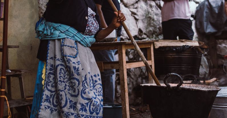 Outdoor Kitchen - A Woman Cooking in an Outdoor Kitchen