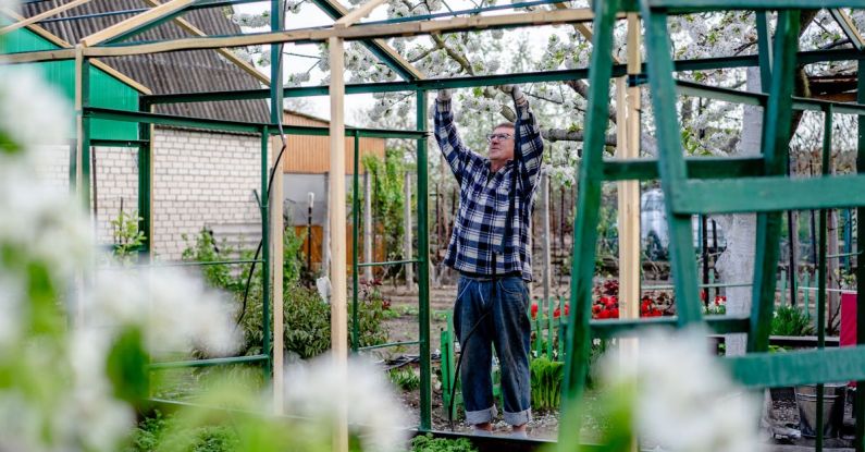 Greenhouse DIY - Man Building a Greenhouse