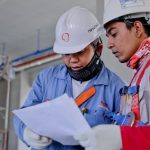 Safety Construction - Two Man Holding White Paper