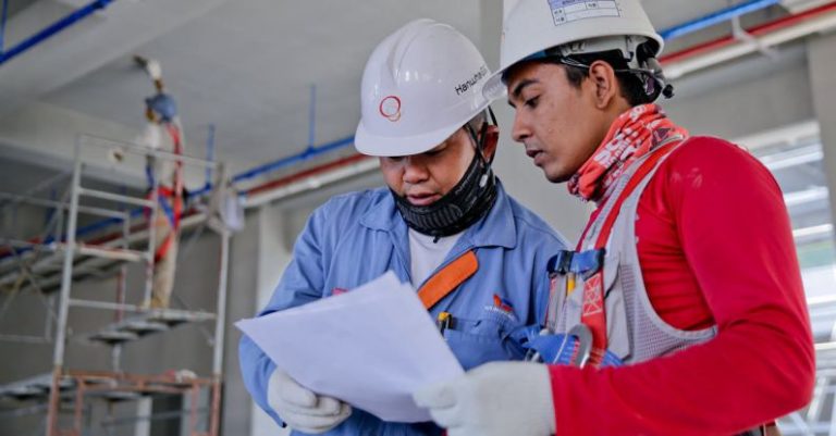 Safety Construction - Two Man Holding White Paper
