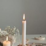 Nanoscale Composites - Candles and stones on a table with a white background