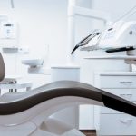 Medical Devices - Black and White Dentist Chair and Equipment