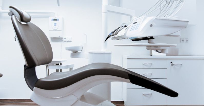 Medical Devices - Black and White Dentist Chair and Equipment